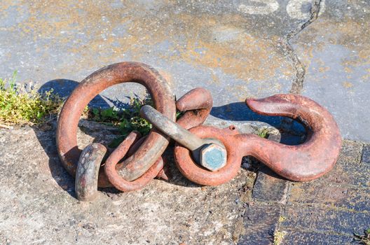 Mooring strap, steel hook and eye at a quay for securing larger motor ships.