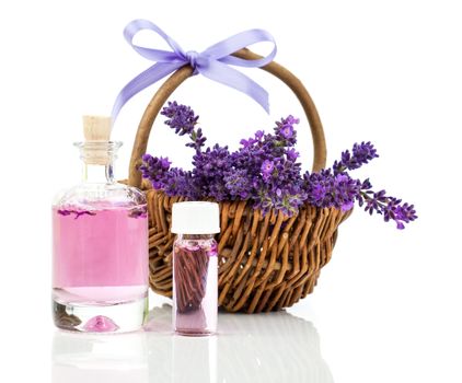 fresh lavender blossoms with Natural handmade lavender oil, on white background