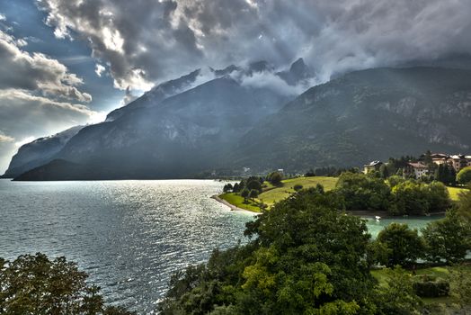 Cloudy sunset on the lake of Molveno in the summer season, Trentino - Dolomites, Italy