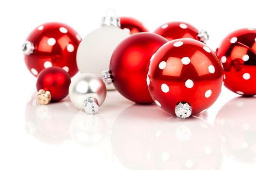 red polka dot Christmas bauble, isolated over white