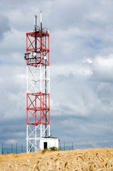 Iron satellite tower in the middle of corp field.