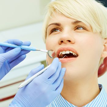 Close-up of a pretty patient with her mouth open