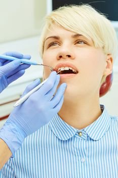 Close-up of a pretty patient with her mouth open