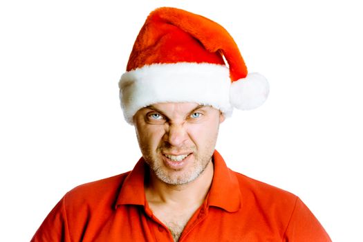 Unshaven blue eyes angry man in a red shirt and Santa hats. Studio. isolated