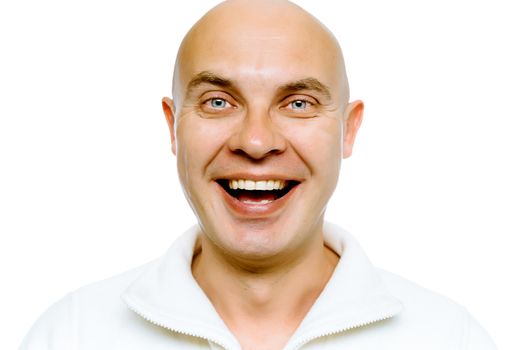 Bald smiling blue-eyed man in a white jacket. Studio. isolated