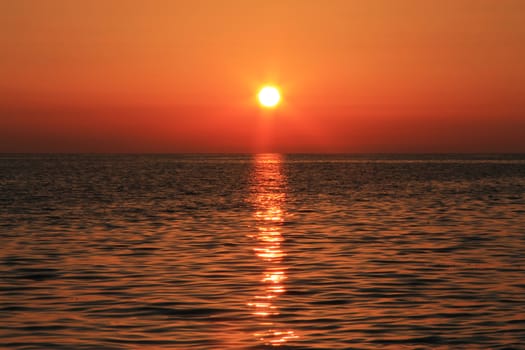 Sunset over the Black sea and summertime beach