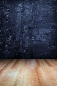 Dark blue grungy concrete wall and wooden floor , use for background