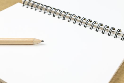 pencil and blank opened notebook , business , education