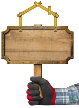 Hand with work glove holding a wooden sign with a meter ruler in the shape of house. Empty sign for the construction industry, isolated on white