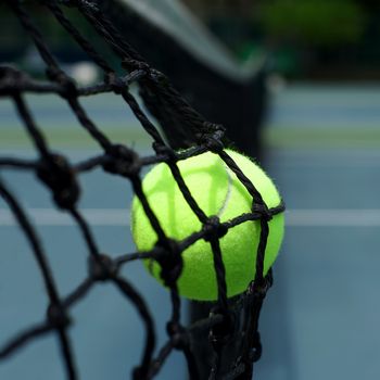 tennis ball in the net