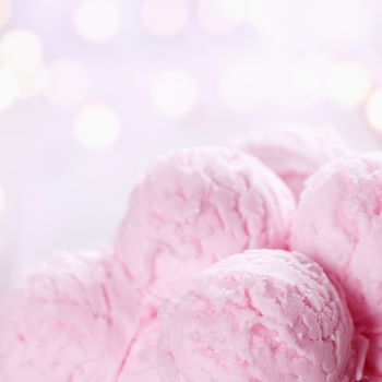 Close up pink ice cream with blurry shiny bokeh background.