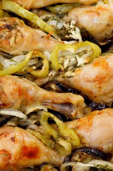 Background of Delicious Roasted Chicken Legs with Green Bell Pepper, Leek and Eggplants closeup