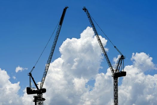 silhouette of construction crane with beautiful sky background