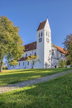 Image of monastery Thierhaupten in Bavaria, Germany in summer with blue sky and grean meadow