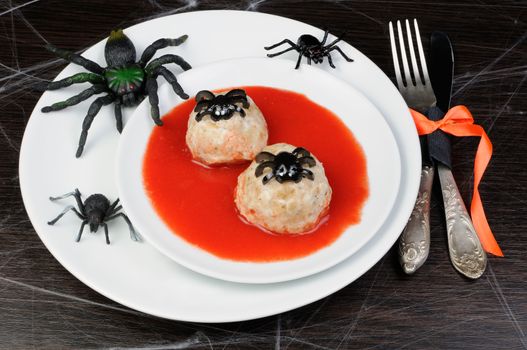  chicken meatballs in tomato gravy on the table in honor of Halloween