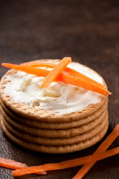 Cookies with cream cheese and strips of carrot