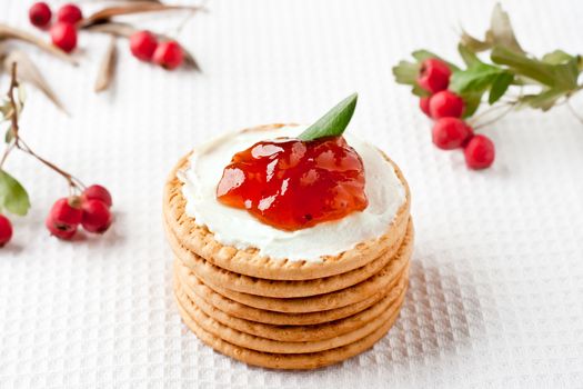 Cookies with cream cheese, strawberry jam and cranberries around