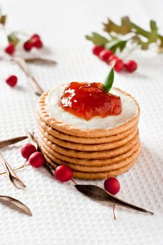 Cookies with cream cheese, strawberry jam and cranberries around