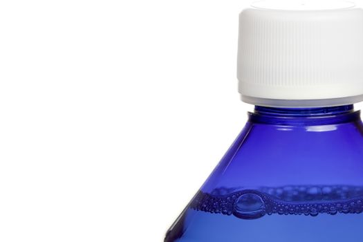 Close up of blue bottle of mouthwash on white background