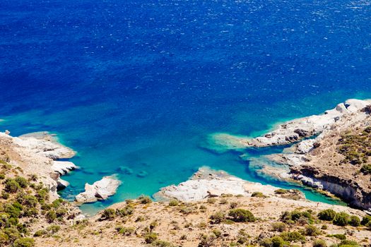 Beautiful ocean coastline and rocky beach with turqouise water, Milos island, Greece