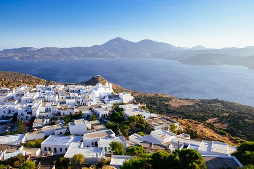 Scenic view of ocean and traditional Greek village Plaka on Milos island, Greece