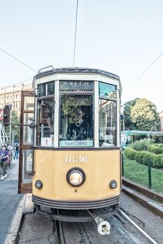 MILAN - SEP 25: Historic tram rides on September 25, 2015 in Milan. Milan transportation system carries 2 million passengers daily.