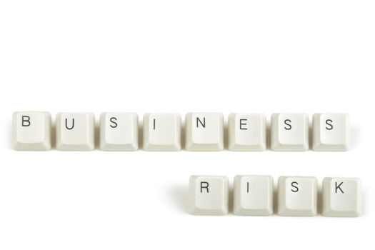business risk  text from scattered keyboard keys isolated on white background