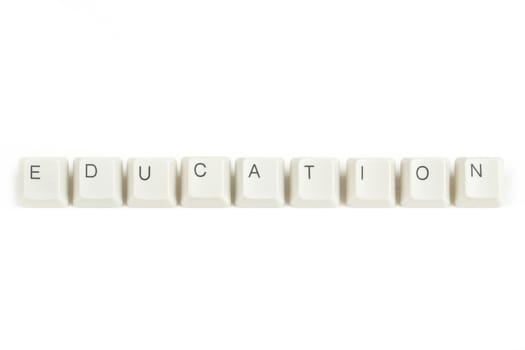 education text from scattered keyboard keys isolated on white background