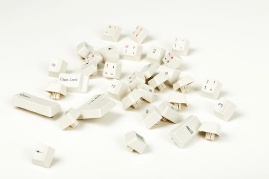 scattered keyboard keys on white background, stock photo