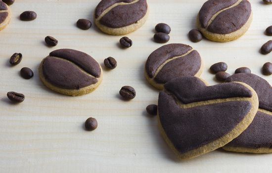 Delicious coffee cookies arranged on a wooden tray
