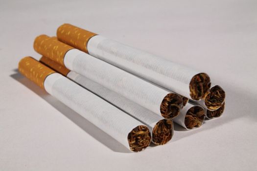 group of cigarettes on white table