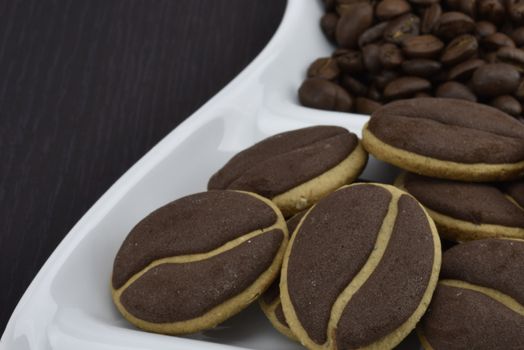 Delicious coffee cookies with coffee beans on a corrugated tray