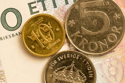 Swedish Currency Close Up. 100 bank notes, and a 10, 5 and 1 krona coin.