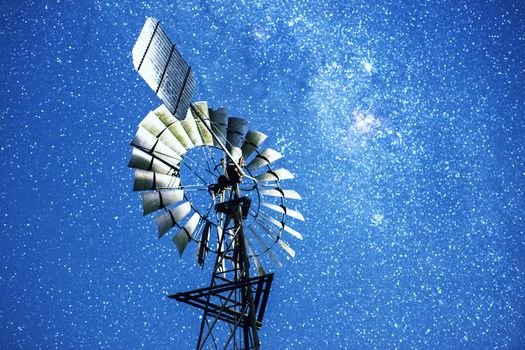 Stars and a windmill at night in the outback of Brisbane, Queensland, Australia.