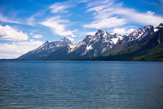 A view of the Grand Tetons from behind Jackson Lake at the Grand Teton National Park in Wyoming