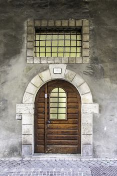 stone arch with old wooden door