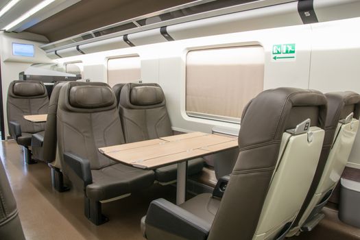 business class with leather seats of a railroad car