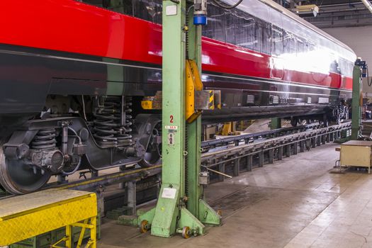 lifting a railway wagon for maintenance in a workshop major repairs