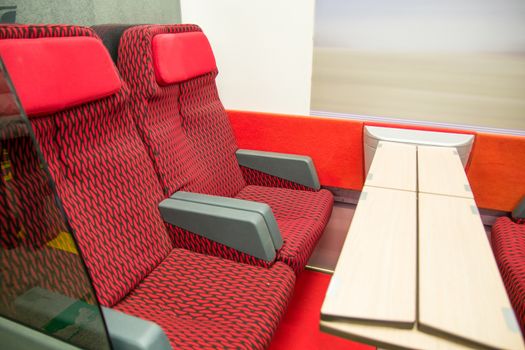 red modern seats of a railroad car