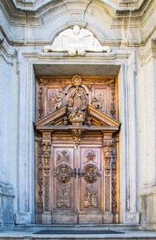 carved wooden portal of an italian church