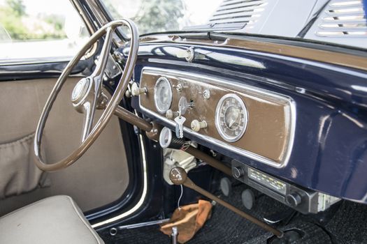 blue and beige interior of italian vintage car