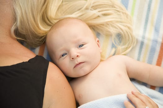 Cute Little Baby Boy Laying Next to His Mommy on Blanket.