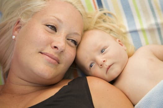 Cute Little Baby Boy Laying Next to His Mommy on Blanket.