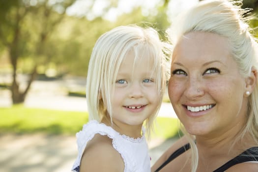 Cute Little Girl Having Fun With Her Mother Outside.