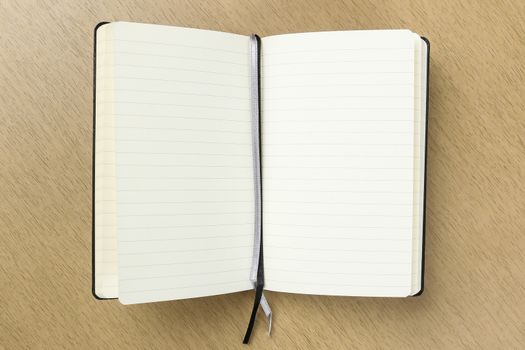 blank opened notebook with bookmark ribbon on the table, business , education
