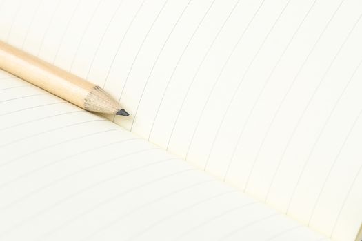 pencil and blank opened notebook , business , education