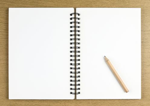 pencil and blank opened notebook , business , education