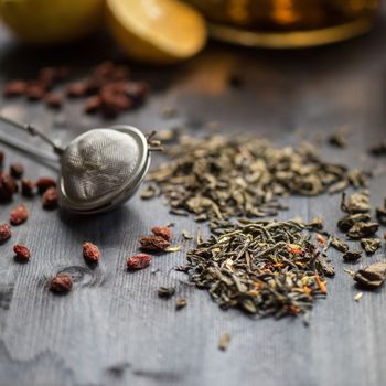 tea composition with cinnamon sticks, lemons