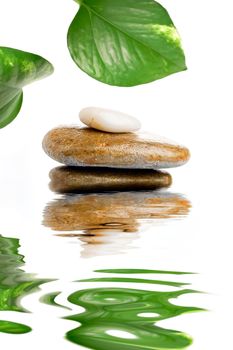 Composition of stones on water creating reflections