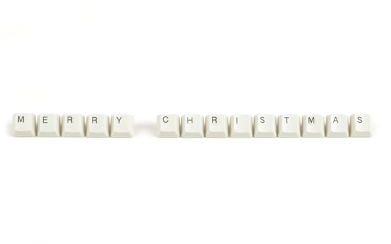 merry christmas text from scattered keyboard keys isolated on white background